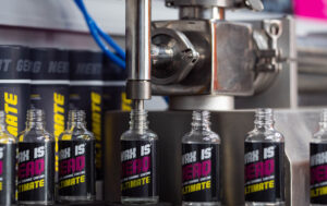 Wax is Dead ceramic coating Perth products on the manufacturing line with machinery.